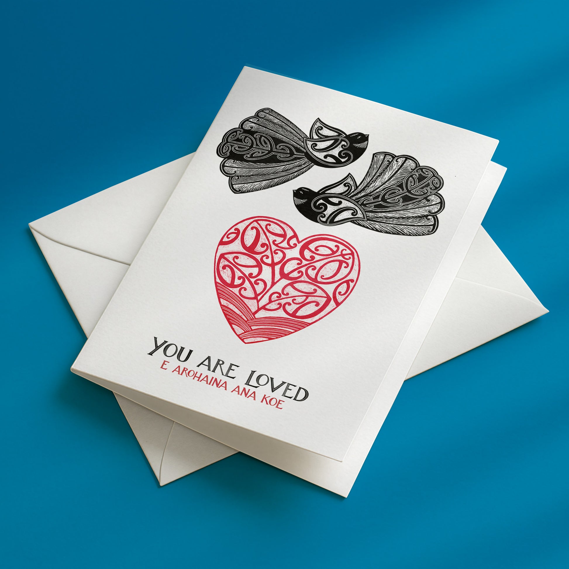 new zealand greeting card with te reo maori you are loved e arohaina ana koe and two piwakawaka birds