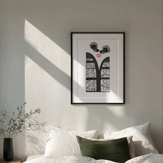 New Zealand pīwakawaka love art print, Ka Rite – Love, Always, featuring two fantails flying above an aroha heart with flowing kōwhaiwhai patterns and a blessing in te reo Māori and English. Framed in black.