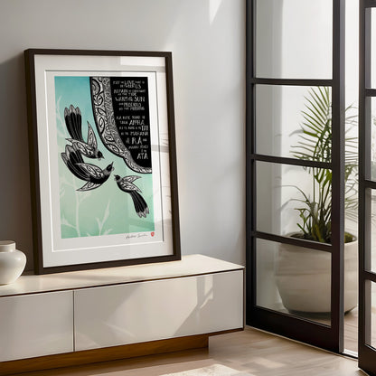 Framed large New Zealand tūī art print, May the Love That Is Between Us, featuring three tūī surrounded by kōwhaiwhai patterns, with a bilingual blessing in te reo Māori and English wishing that love remain constant as the tide, warm as the sun and precious as the morning.