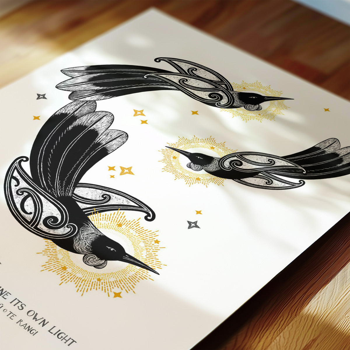 Three tui shining like stars, surrounded by golden rays, with the whakataukī Tukua kia tū takitahi ngā whetū o te rangi beneath, symbolising individuality and the beauty of diversity.