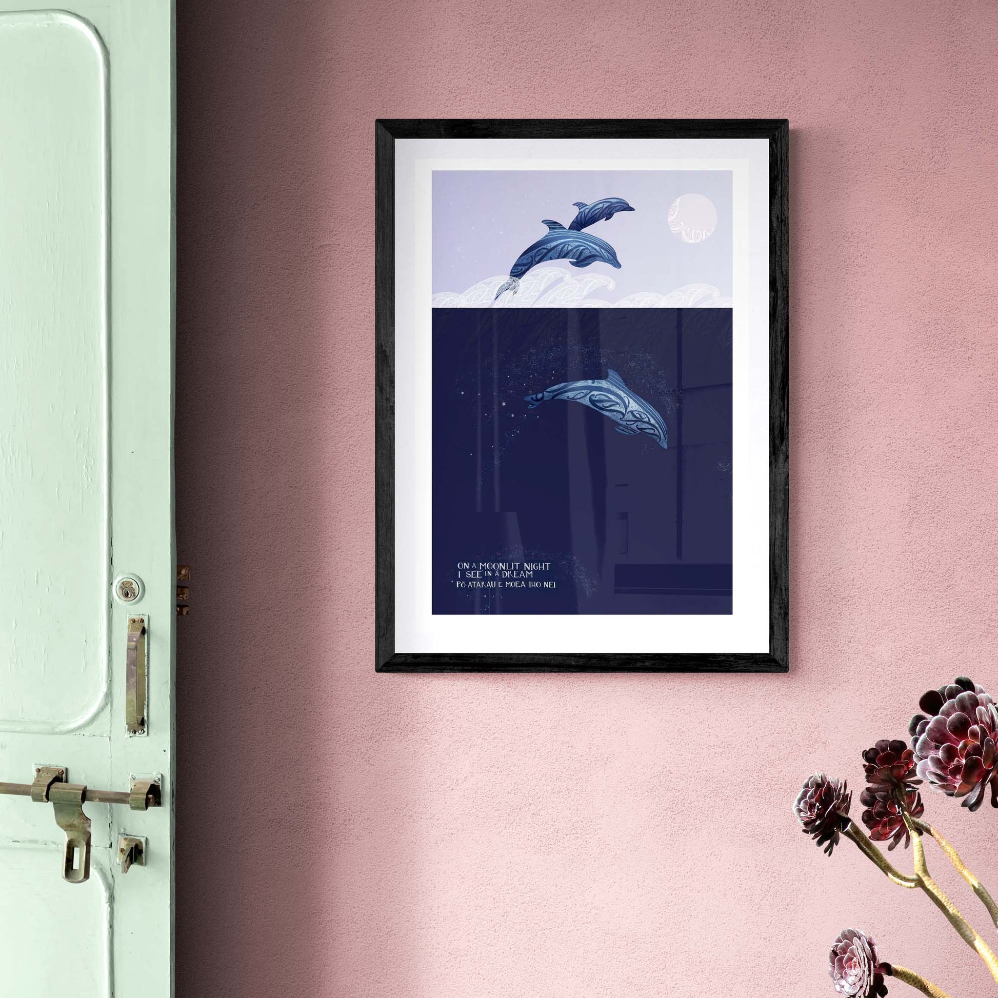 mockup of dolphin art print with maori art design elements and words from Po atarau now is the hour in te reo and english. By amber Smith nz artist
