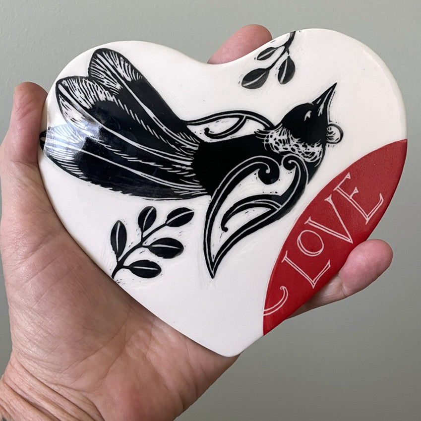 Ceramic wall heart with Tui bird and the word Love