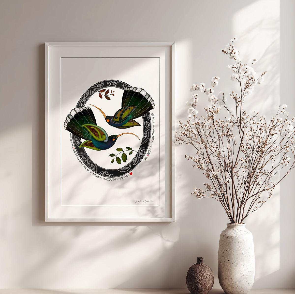 Framed inspirational New Zealand huia bird art print, Tūmanako – Hope, featuring two huia taking flight into the light of a new dawn, with a te reo Māori karakia about the birds calling and the day beginning.